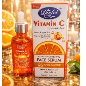 A bottle of Diefei 3D Vitamin C Face Serum with a glass dropper alongside its orange product box, surrounded by sliced oranges and golden lights.