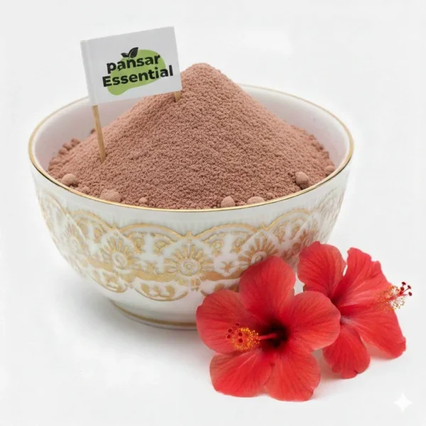 Pure finely ground hibiscus powder in a gold-patterned white ceramic bowl with a Pansar Essential flag label alongside fresh red hibiscus flowers on a white background.