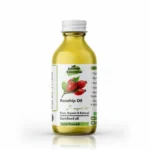 Glass bottle of Pansar Essential Pure Organic Cold Pressed Rosehip Oil with white cap against a plain background.