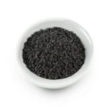 Small white ceramic bowl filled with raw, dry black basil seeds (Tukhm-e-Malanga) on a isolated white background.