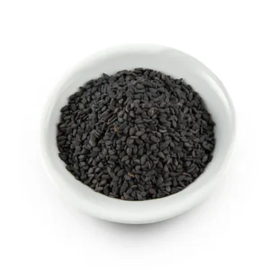 Small white ceramic bowl filled with raw, dry black basil seeds (Tukhm-e-Malanga) on a isolated white background.