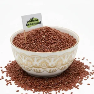 A white ceramic bowl filled with raw, nutrient-rich brown Haloon seeds featuring a small Pansar Essential brand flag.