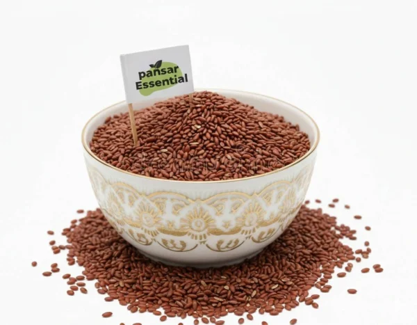 A white ceramic bowl filled with raw, nutrient-rich brown Haloon seeds featuring a small Pansar Essential brand flag.