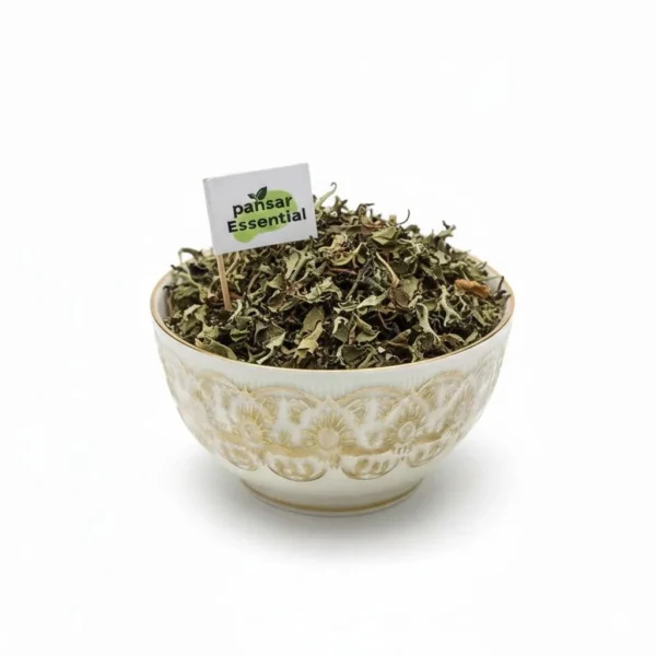 Dried Charila herb leaves (Parmelia Perlata / Pathar Phool) overflowing in a patterned white ceramic bowl with a small Pansar Essential flag.