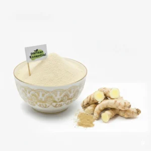 A white decorative bowl filled with fine Kachoor Powder featuring a small Pansar Essential flag, placed next to raw white turmeric roots on a clean white background.
