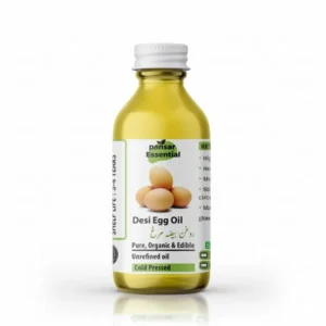 A clear glass bottle of Pansar Essential Desi Egg Oil containing golden-green liquid, featuring a label with three eggs, Urdu text, and a product summary against a white background with a shadow.